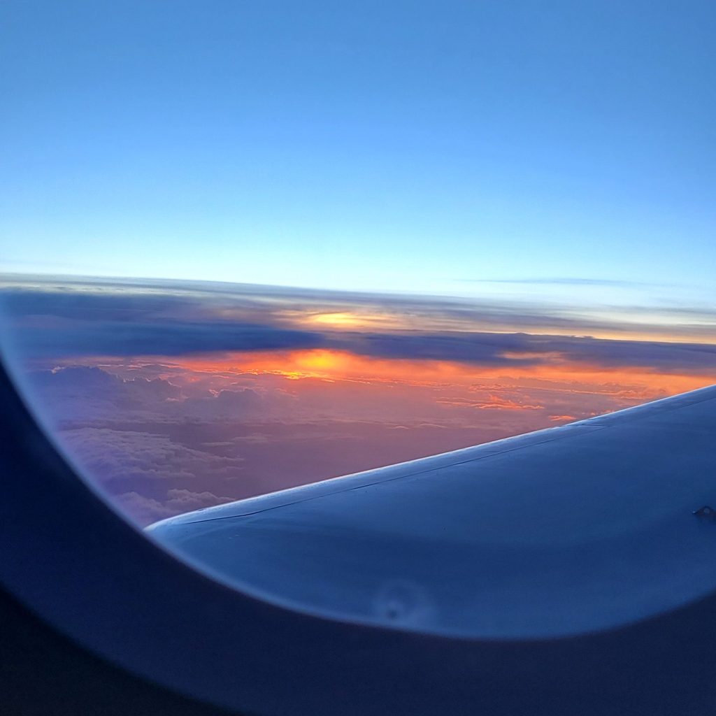 Sunset view from airplane window during flight